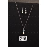 9ct white gold necklace and earring set with aquamarine and pearl, hallmarked 375