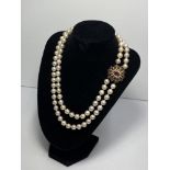 A double strand cultured graduated pearls necklace knotted in between pearl size ranging from 8mm to