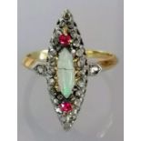 An Edwardian opal, ruby and diamond ring in a yellow metal cage setting, size O