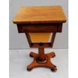 An early Victorian mahogany ladies work table with single drawer on an octagonal support and platfor