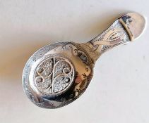 A George III silver caddy spoon with elaborate filigree decoration by Samuel Pemberton, Birmingham,