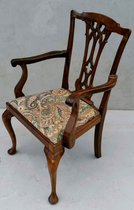 A Georgian mahogany-framed carver chair in the Chippendale style with urn-shape splat, drop in seat