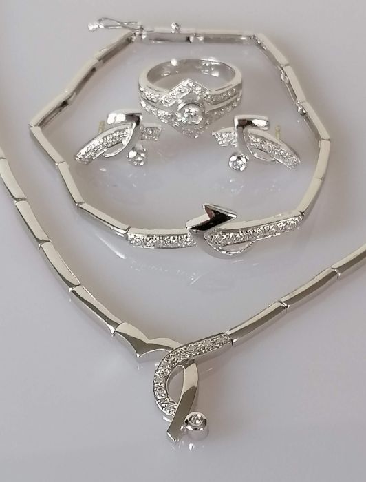 A parure comprising of a white gold articulated necklet with integral pendant and diamond decoration - Image 2 of 2