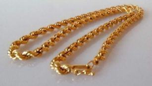 A gold rope twist neck chain, 46 cm, unmarked, test for 18ct gold, 23.6g