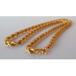 A gold rope twist neck chain, 46 cm, unmarked, test for 18ct gold, 23.6g