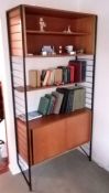 A mid 20th century Ladderax teak modular shelving unit with open shelving to top, central shelf and