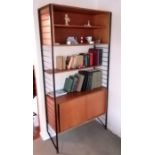 A mid 20th century Ladderax teak modular shelving unit with open shelving to top, central shelf and