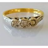 A gold three-stone diamond illusion-set ring, size M, stamped 18ct, 3.2g