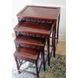 A Chinese hardwood nest of four tables with carved decoration, 64 h x 51 w x 35 d cm