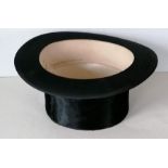 A silk top hat by Dunn & Co., Oxford Street with fitted box, rim size approx 21", in good condition