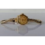 A gold-cased ladies 9ct gold Zodiac dress watch with subsidiary seconds hand on a woven gold strap,