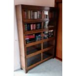 A matching set of three Art Deco oak-stained barrister bookcases in the Globe Wernicke style, the la