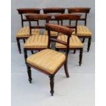 A set of six George IV mahogany-framed dining chairs with carved support, fabric upholstery, on flut