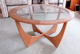 A G-Plan "Astro" teak circular coffee table, labeled, with plate glass insert, 84cm diameter, 45cm H