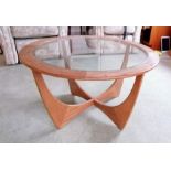 A G-Plan "Astro" teak circular coffee table, labeled, with plate glass insert, 84cm diameter, 45cm H