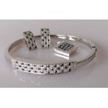 A diamond and sapphire parure on 18ct white gold comprising bangle, earrings and pendant