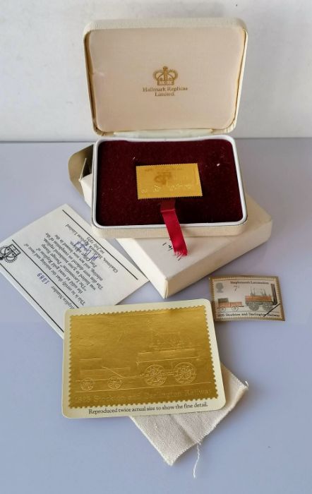 A cased 22ct gold replica of 'The Locomotion' postage stamp, 1975 with CoA no. 1589 and original pac