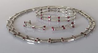 A ruby and diamond parure on a white gold setting