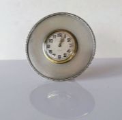 An Art Deco desk or strut clock with engine turned decoration by Goldsmiths & Silver