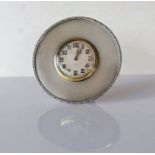 An Art Deco desk or strut clock with engine turned decoration by Goldsmiths & Silver