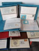 Three albums each containing five United Nations/Franklin Mint medallic First Day Covers from 1973,