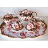 An Edwardian Royal Crown Derby tea service, pattern 2649 comprising four cup/saucers/plates, cove