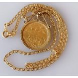 A Victorian gold half sovereign, 1900, on a 9ct gold mount and chain, hallmarked, 7.5g