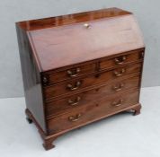 A Georgian mahogany bureau with fall front, fitted interior, complete with secret drawers