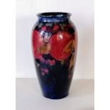 A William Moorcroft tube-lined vase decorated in the 'Pomegranate' design, impressed marks Moorcroft
