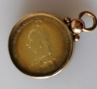 A Victorian Jubilee Head Shilling, 1887, cased in a 9ct gold pendant, 11.02g