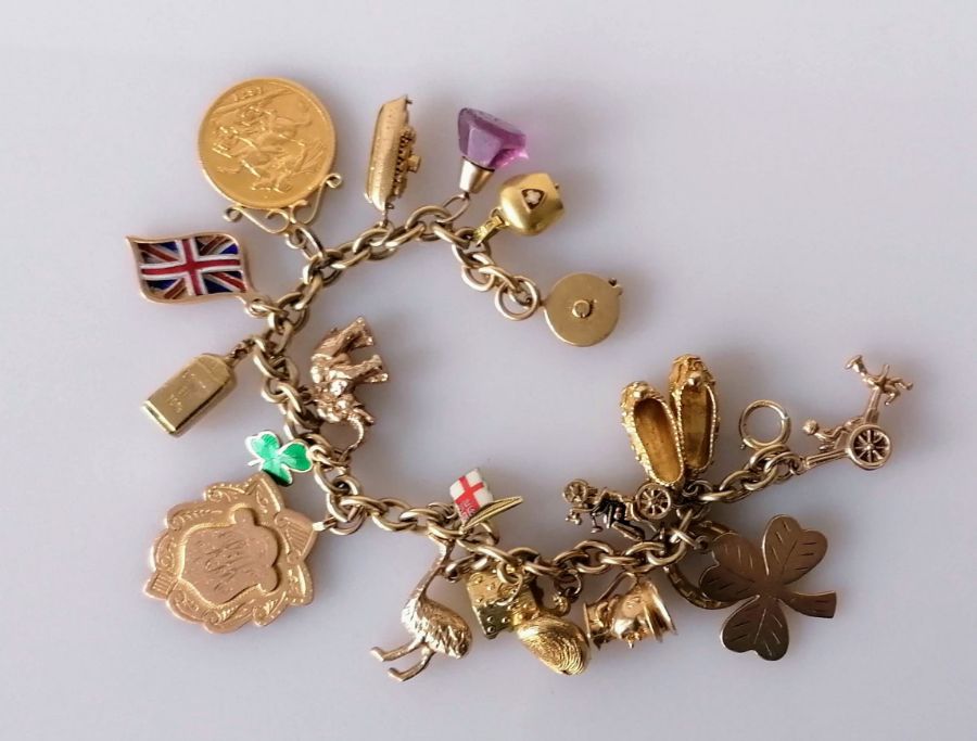 A 9ct yellow gold charm bracelet, all hallmarked, to include a Victorian gold full sovereign, 1871,