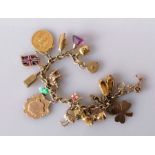 A 9ct yellow gold charm bracelet, all hallmarked, to include a Victorian gold full sovereign, 1871,