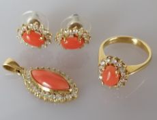 A yellow gold coral and diamond cluster ring with matching pendant and earrings