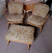 A pair of mid century Ercol blonde beech and elm armchairs and matching footstool, models 203 and 34