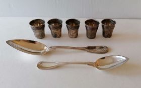 A set of five French silver shots, possibly by Albert Beauford a dessert spoon and a table spoon, mi