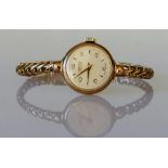 A vintage ladies dress watch with 9ct gold case and woven bracelet strap, hallmarked, 20g
