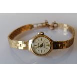 A mid-century ladies Accurist dress watch with 9ct gold case and bracelet strap, hallmarked, catch f