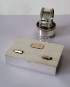 A 20th century colonial silver wood-lined cigarette box with gold mounts, stamped 's.silver', mounts