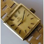 A vintage ladies gold Omega watch with graduated textured bracelet strap, hallmarked 9ct, in working