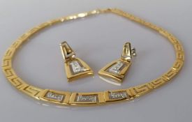 A yellow gold and diamond necklace with Greek key design of tapering form with matching earrings