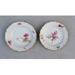 A pair of Meissen plates with floral decoration, fitted for hanging, double sword marks for 1775-17