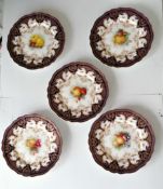 An Edwardian Royal Worcester dessert set comprising: a pair of oval hand-painted oval dishes, 27.5 x