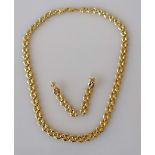 A yellow and white gold fancy-link necklace with lobster clasp and matching earrings, 40 cm,