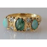 An Edwardian gold three-stone opal and diamond ring, size K, marks rubbed, tests for 14ct, 4.5g