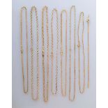 A selection of seven 9ct yellow gold neck chains (shortest 38 cm, longest 43cm), one with matching