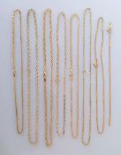 A selection of seven 9ct yellow gold neck chains (shortest 38 cm, longest 43cm), one with matching