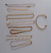 An assortment of seven gold neck chains, all clasps good and a gold bangle, all hallmarked 9ct, 15g