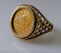 A 1980's Isle of Man Angel 1/10 ounce gold coin mounted on a pierced 9ct gold ring, hallmarked, size