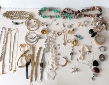 An assortment of mixed costume jewellery to include fashion watches, necklaces, bangles, rings, etc