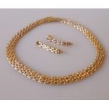 An 18ct yellow and white gold brick-link necklace and matching earrings, 41 cm, hallmarked, 41.35g